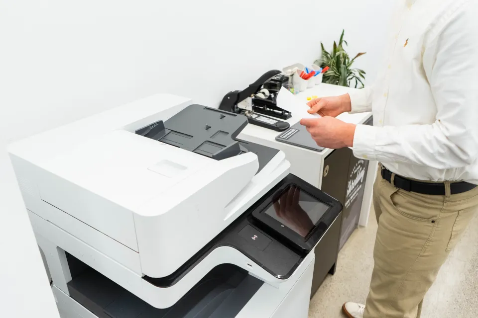 Person working beside an office copier